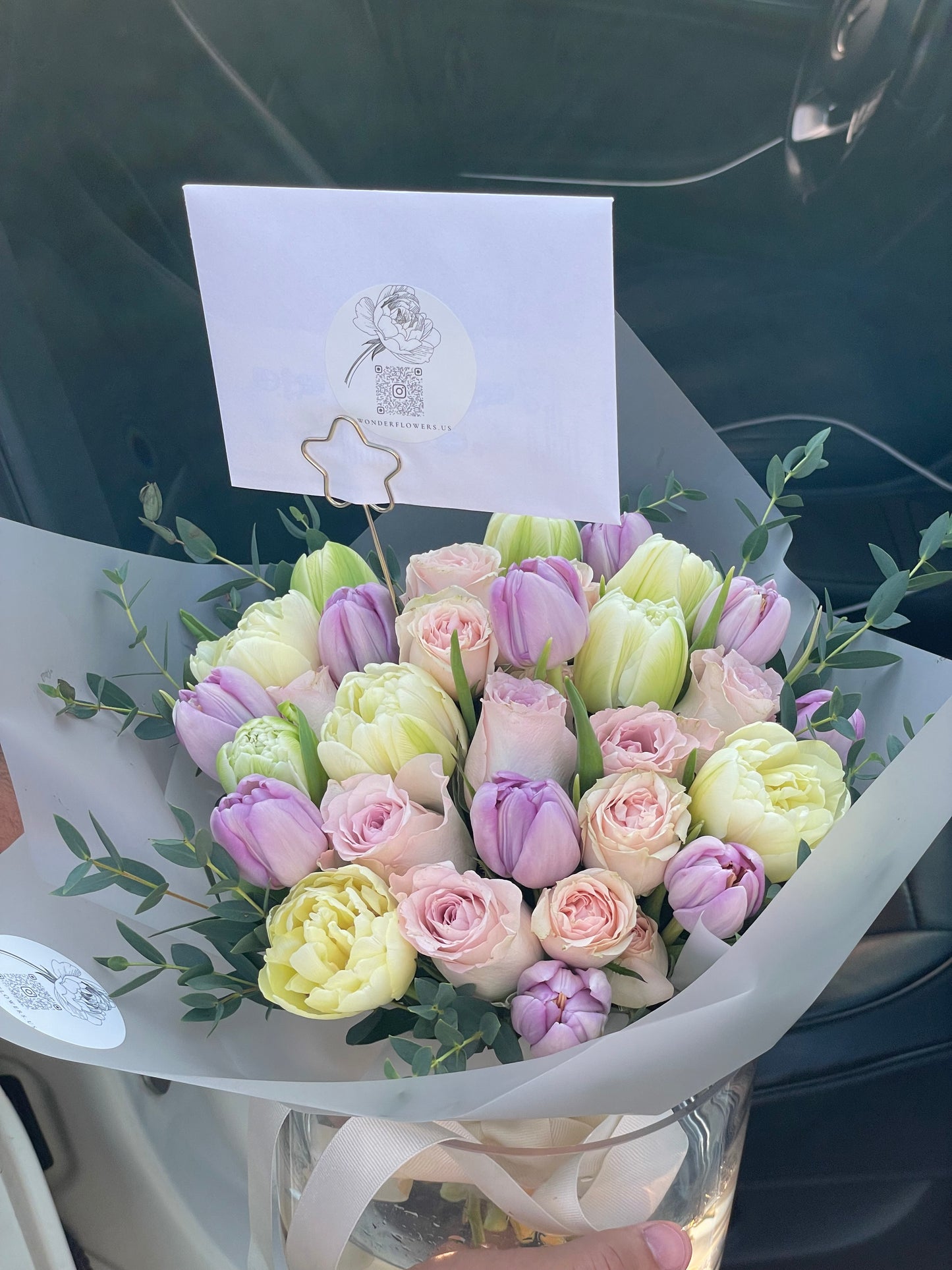 Mix of flowers Pure Delight in a clear vase