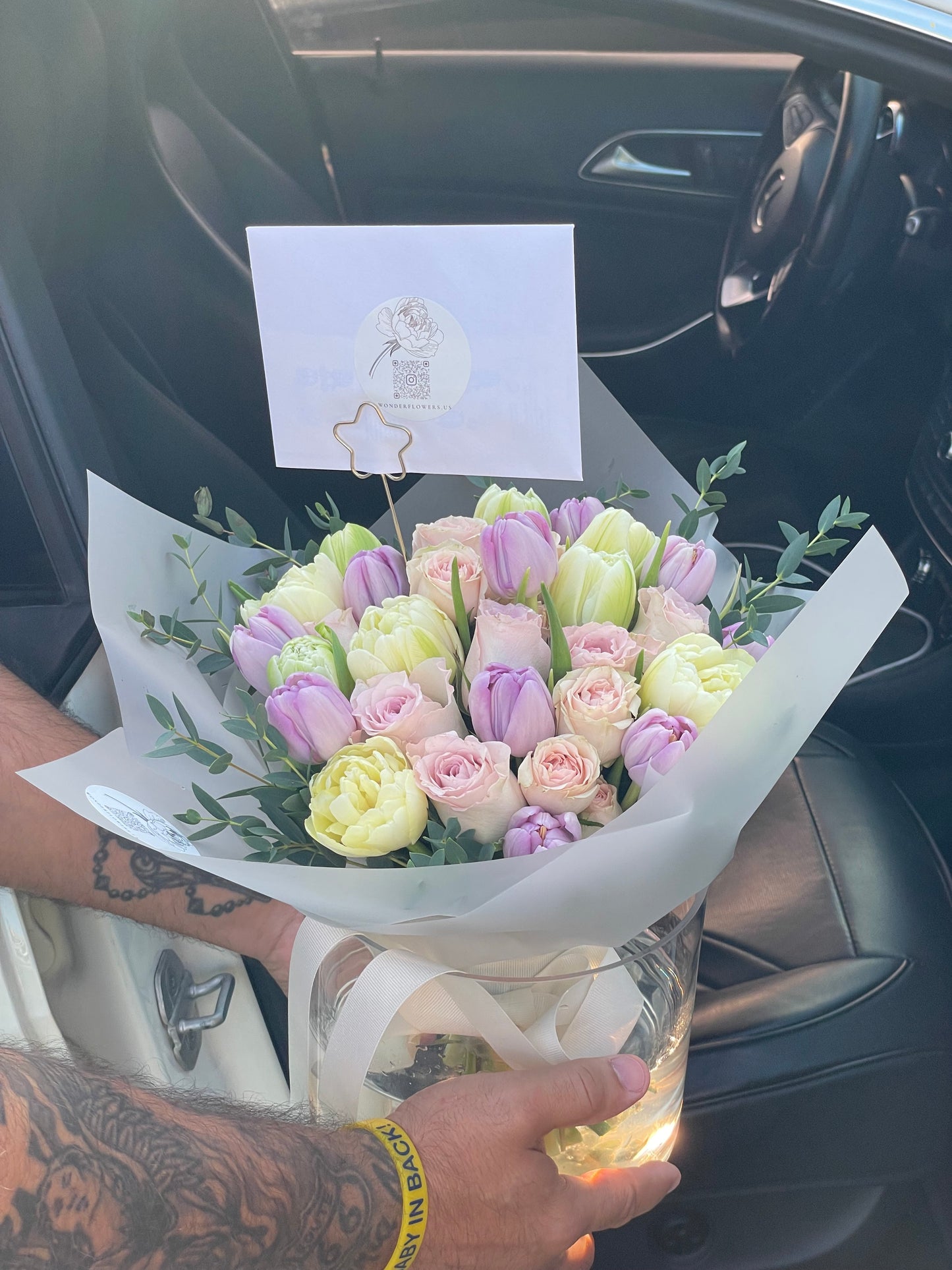 Mix of flowers Pure Delight in a clear vase