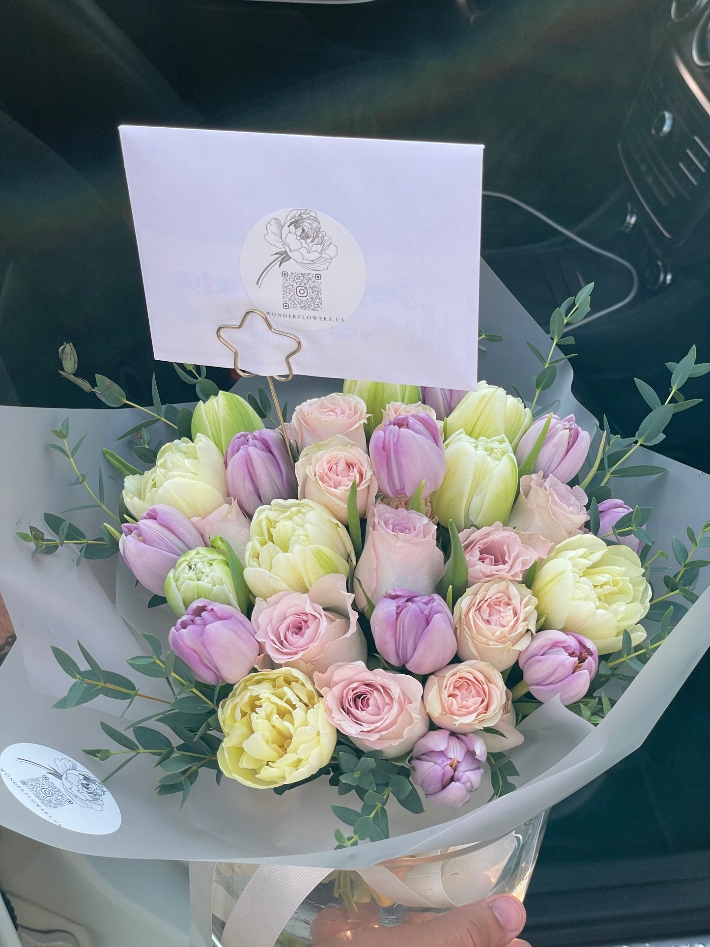 Mix of flowers Pure Delight in a clear vase