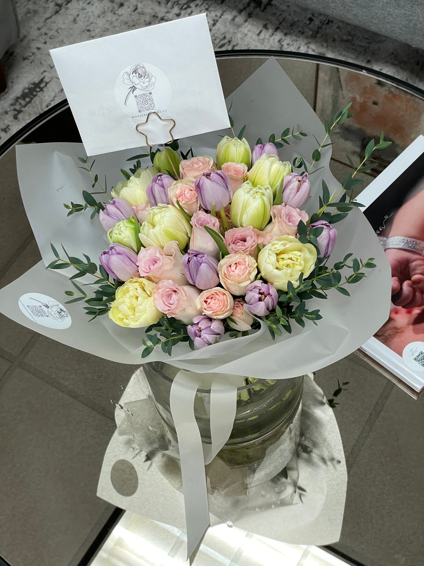 Mix of flowers Pure Delight in a clear vase