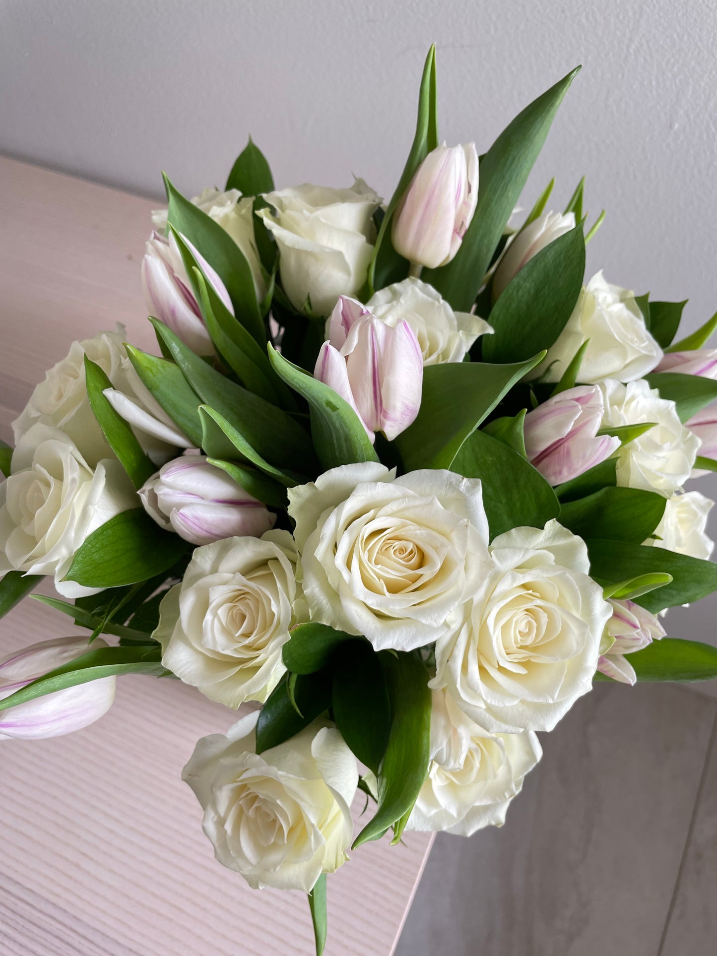 Mix of flowers in a clear vase